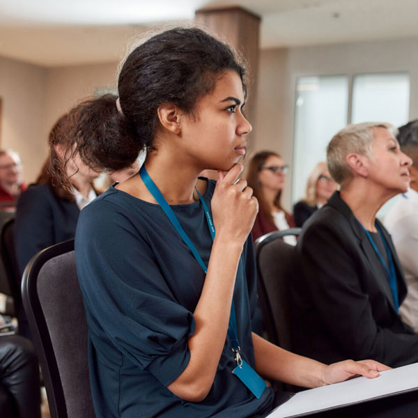 Young woman listening to a presentation